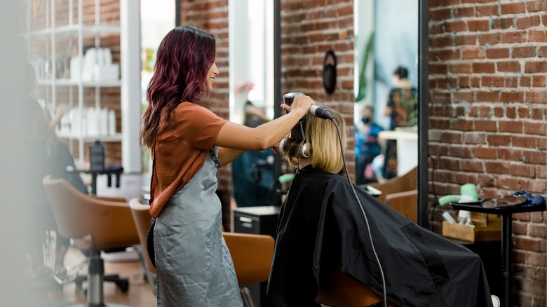 woman getting haircut 