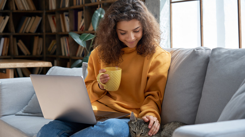 woman with laptop on lap 