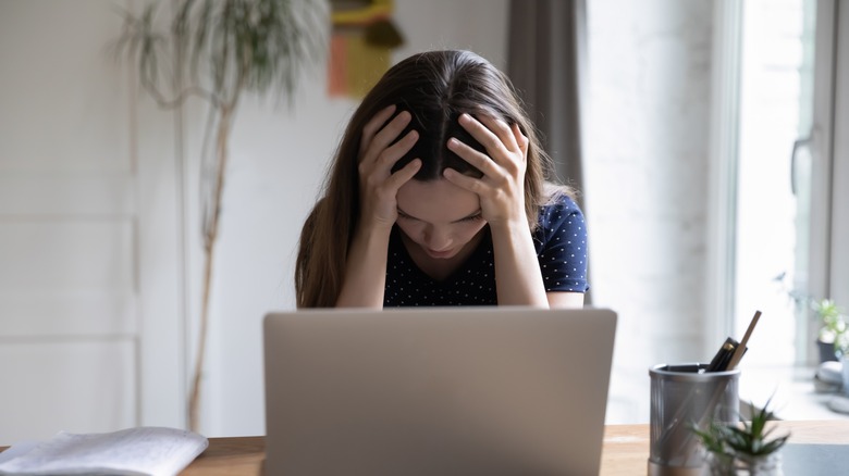 frustrated woman looking at computer