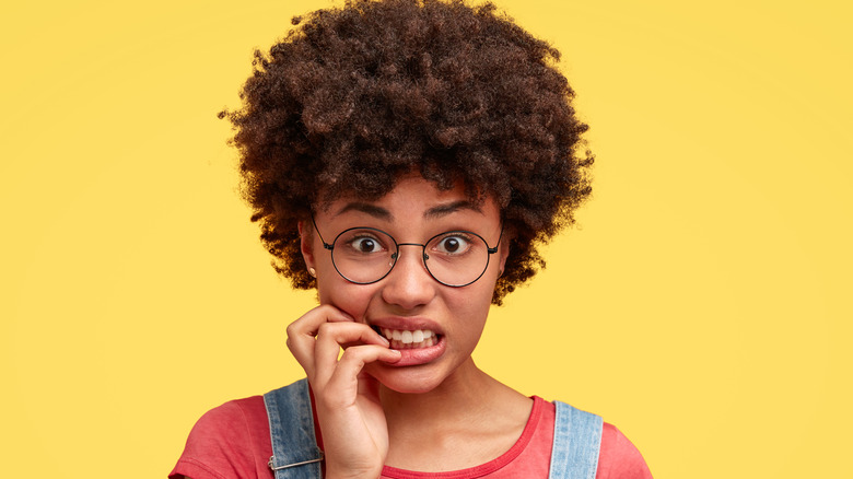 woman biting her nails