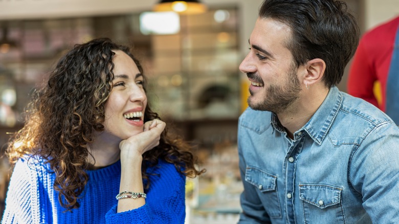 woman smiling at man