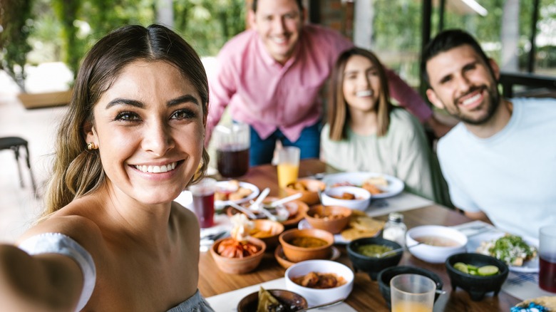 Woman takes selfie at lunch