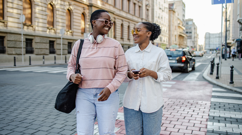 women walking and talking