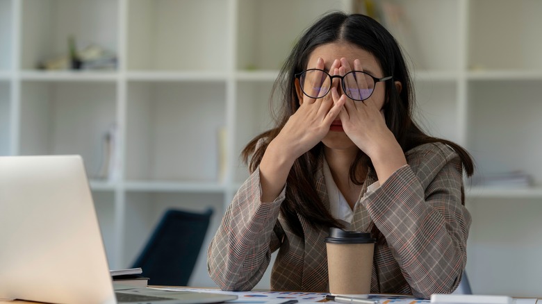 Woman rubbing her eyes 