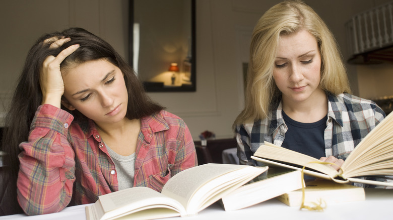 Two friends reading