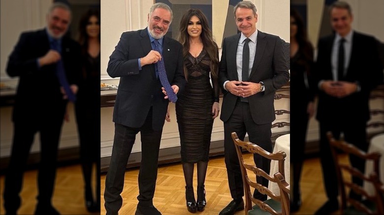 The prime minister of Greece, Kimberly Guilfoyle and Nikos Tsakos pose for a photo