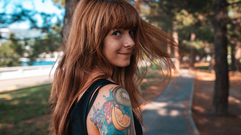 Woman with sleeve tattoo