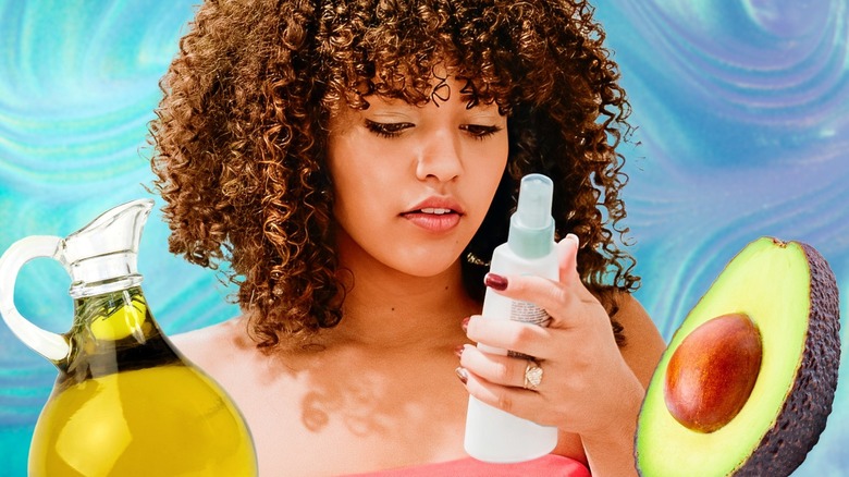 Curly-haired woman examining hair products
