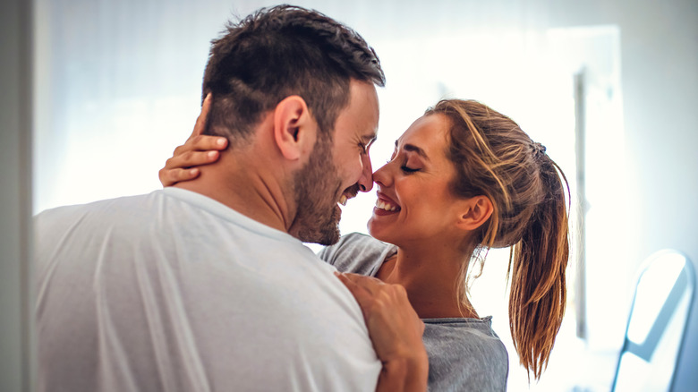 young white couple embracing each other