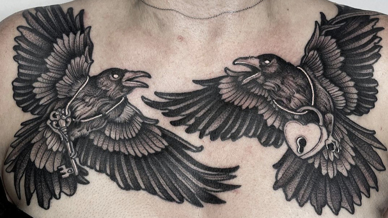 crow tattoos on woman's chest