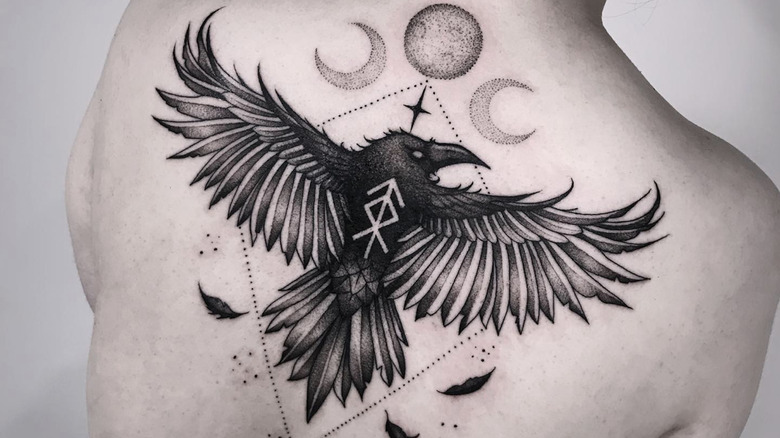 Inside The Dark And Mysterious Meanings Behind A Crow Tattoo