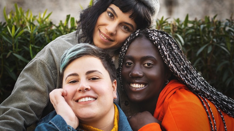 Three women in bright colors