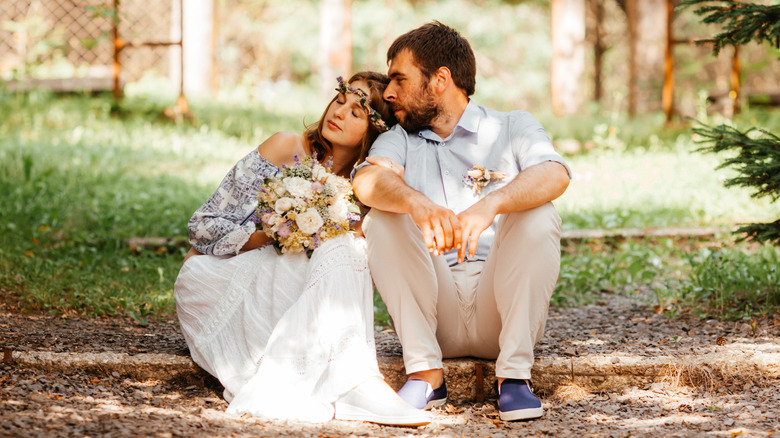 bride and groom sitting 