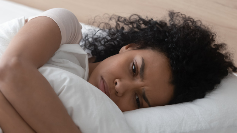 woman in bed alone