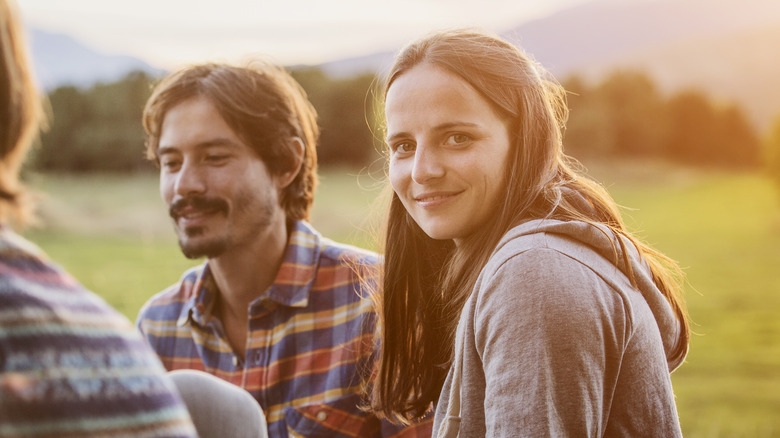 Woman smiling at campsite