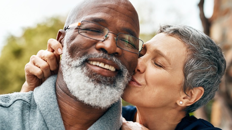 couple kissing and smiling