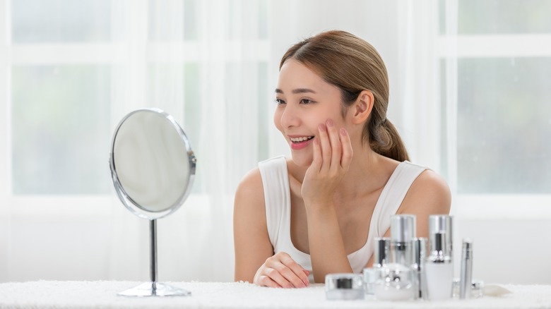 woman applying skincare routine