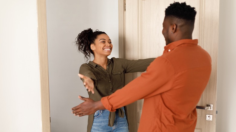 Man and woman mid-embrace