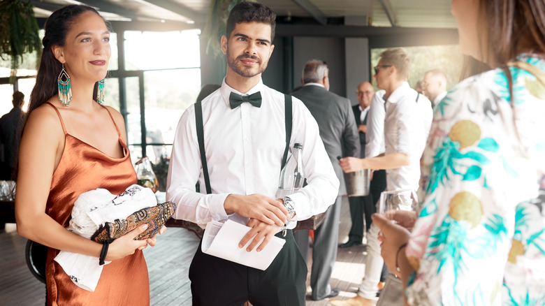 people talking at wedding