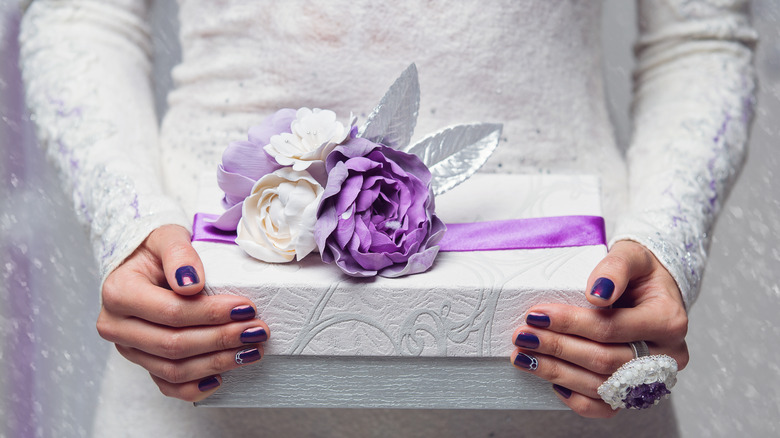 person holding wedding gift