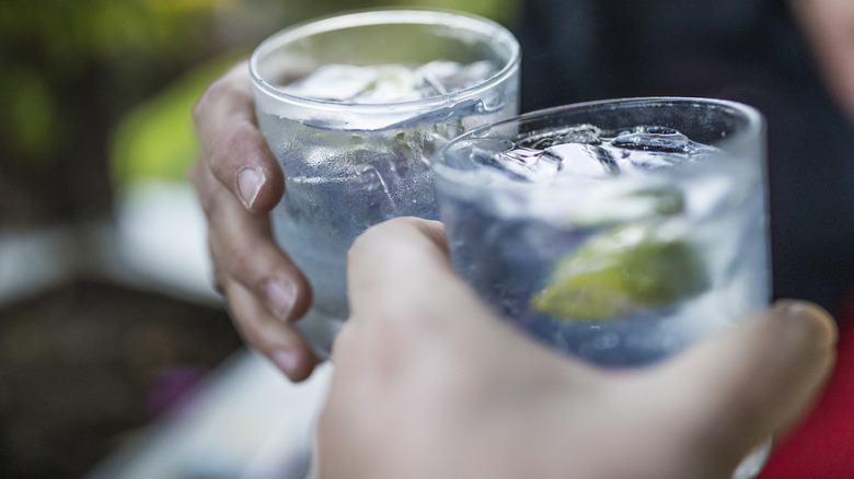 Toasting with drinks on ice