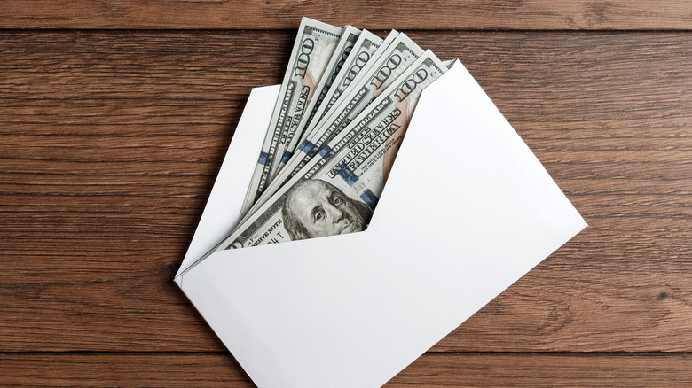 Envelope of money sits on a table