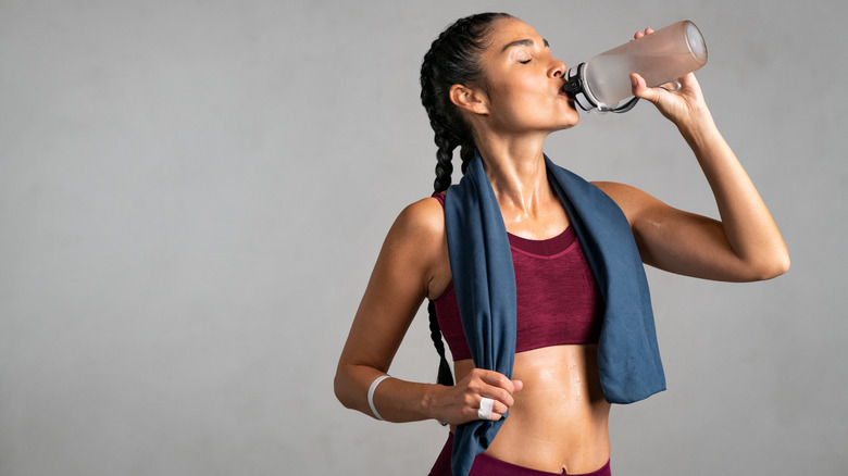 Woman drinking from bottle