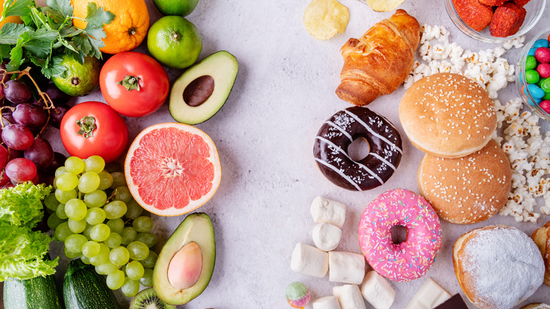 Assortment of fresh fruits and vegetables versus baked goods and sweets