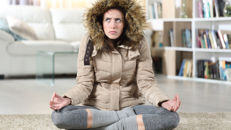 Woman meditating but confused