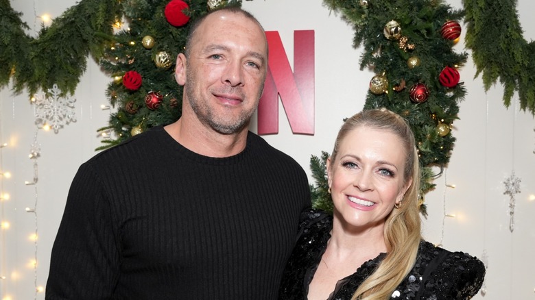 Mark Wilkerson and Melissa Joan Hart both wear black while attending the 
