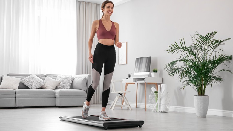 Woman standing on treadmill