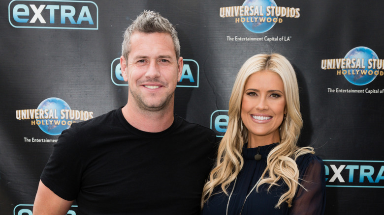 Christina Haack and Ant Anstead smiling while visiting "Extra" at Universal Studios