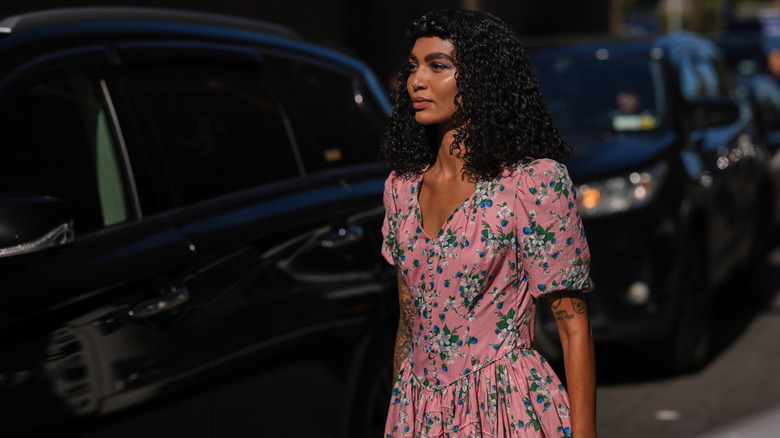 woman with pink floral dress