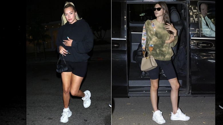 Anastasia Karanikolaou wearing a black sweatshirt and biker shorts with white sneakers in Los Angeles in August 2019 / Vittoria Ceretti wearing a tie-dye sweatshirt and black biker shorts during Milan Fashion Week in September 2019