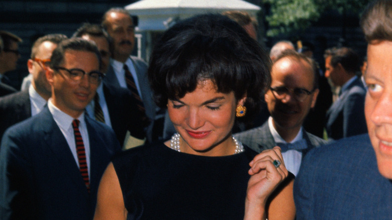 Jackie Kennedy showing off her ring next to John F. Kennedy