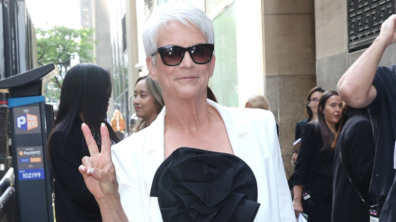 Jamie Lee Curtis smiling with her signature white short hair