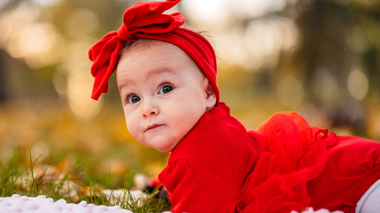 Baby girl wearing a red outfit