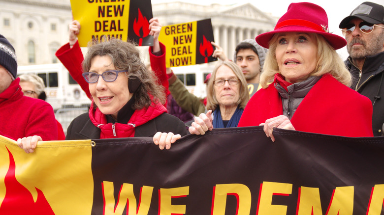 Lily Tomlin and Jane Fonda lead a Fire Drill Fridays climate change protest march to the United States Capitol December 2019