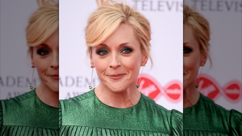 Jane Krakowski smiles wearing a green dress