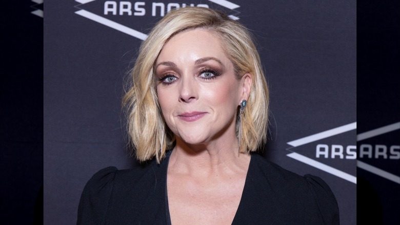 Jane Krakowski with a blond bob and a black top
