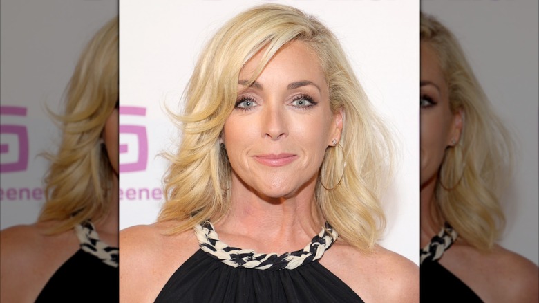 Jane Krakowski smiles wearing a black top
