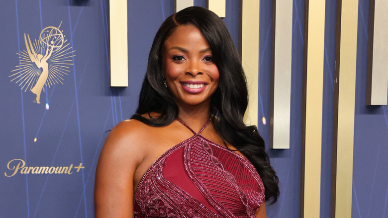 Janelle James in a red dress