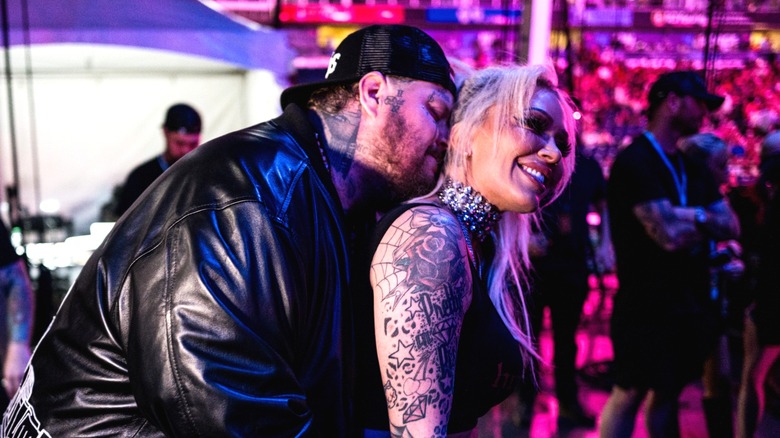 Jelly Roll kissing Bunnie Xo's neck