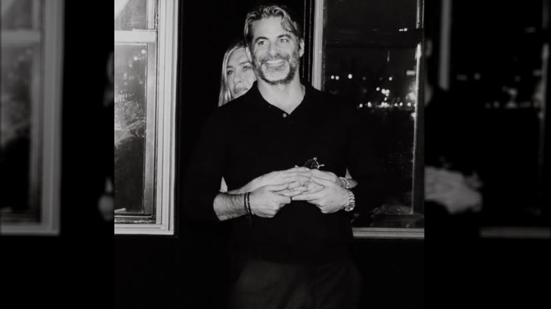 Jennifer Aniston wraps her arms around Jim Curtis