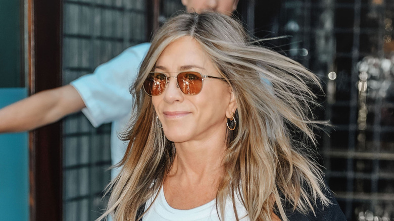 Jennifer Anitson wearing colored-lens glasses