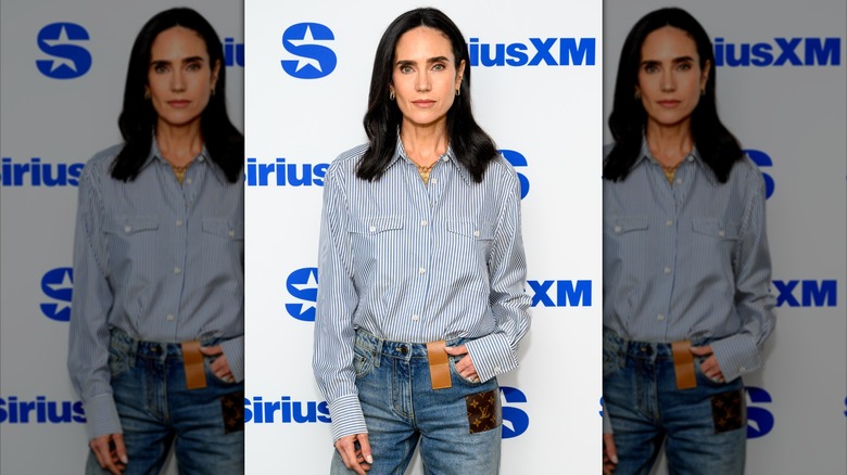 Jennifer Connelly poses in a button-down and jeans