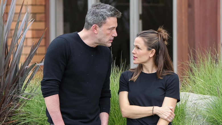 Jennifer Garner and Ben Affleck wearing black tee shirts and looking serious