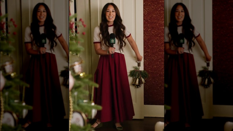Joanna Gaines wearing a white t-shirt and red maxi skirt