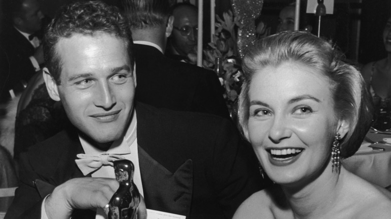 Paul Newman and Joanne Woodward posing at the 1958 Oscars.