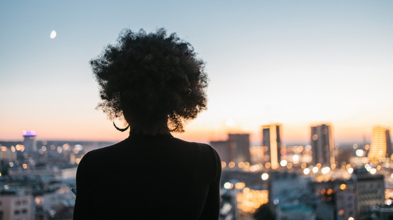 woman looking at cityscape 